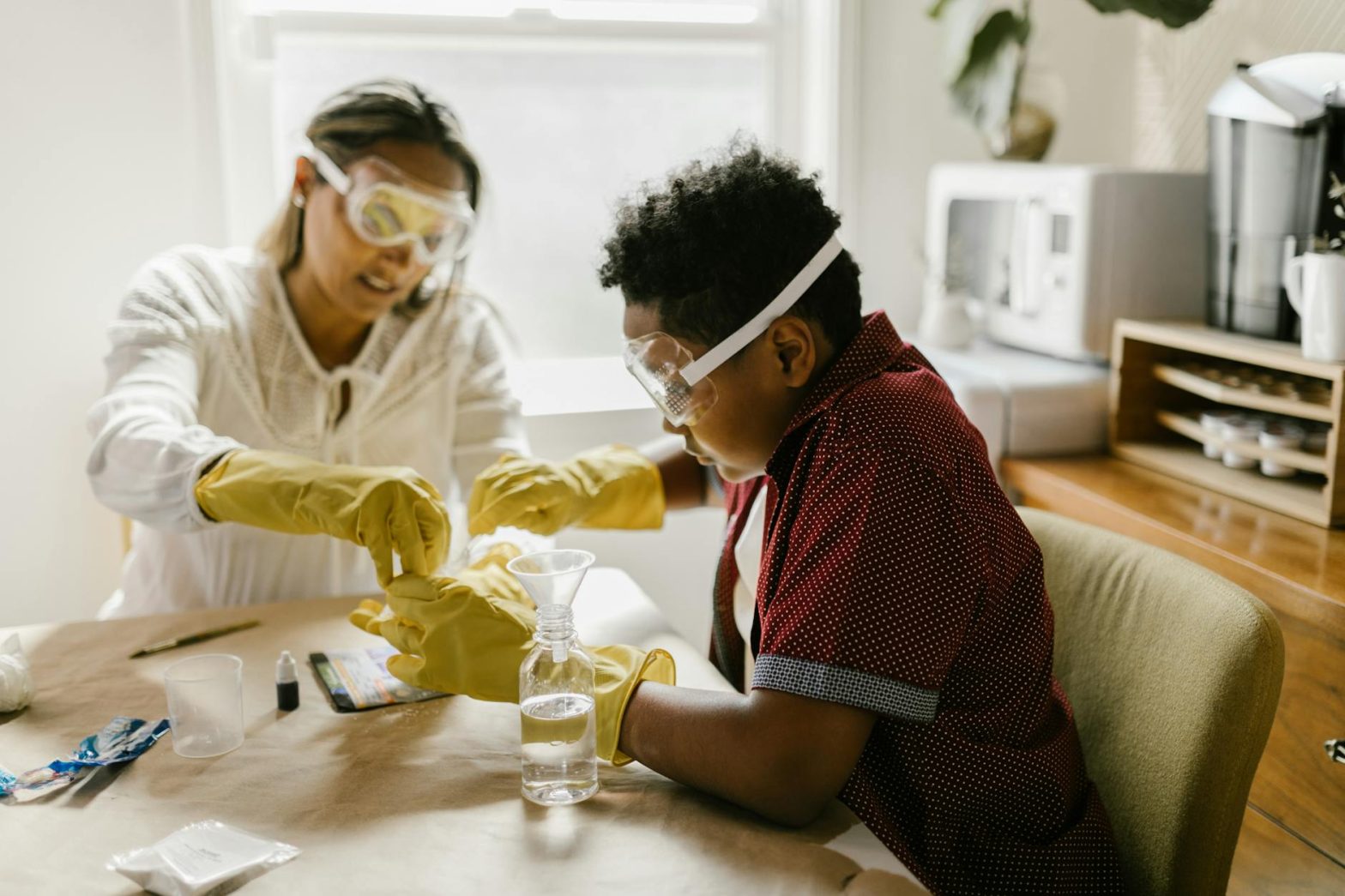 Mother and son conducting a fun science experiment together at home, fostering creativity and learning.